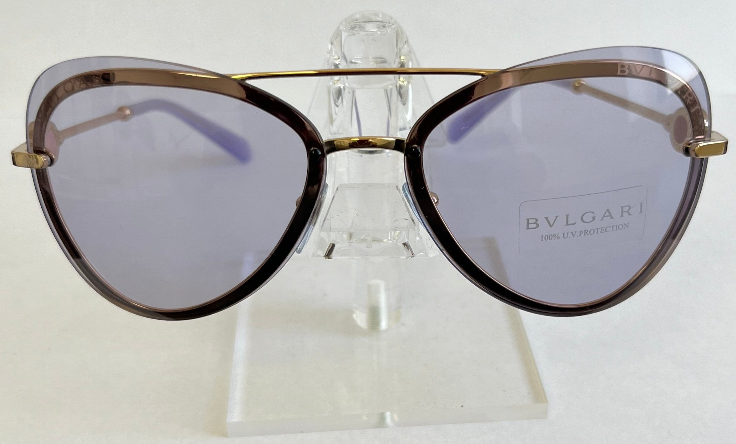 Bulgari sunglasses on a clear stand with a white background