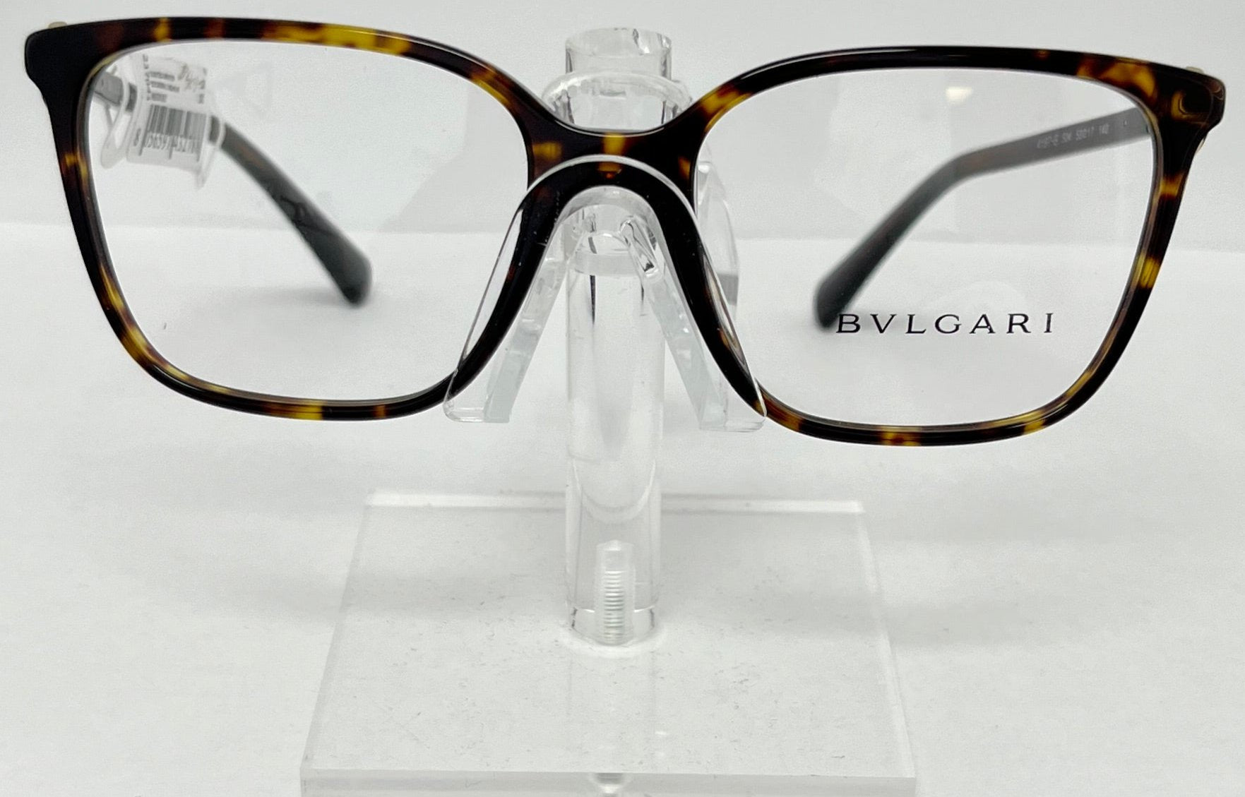 Bulgari eyeglasses on a clear stand with a white background