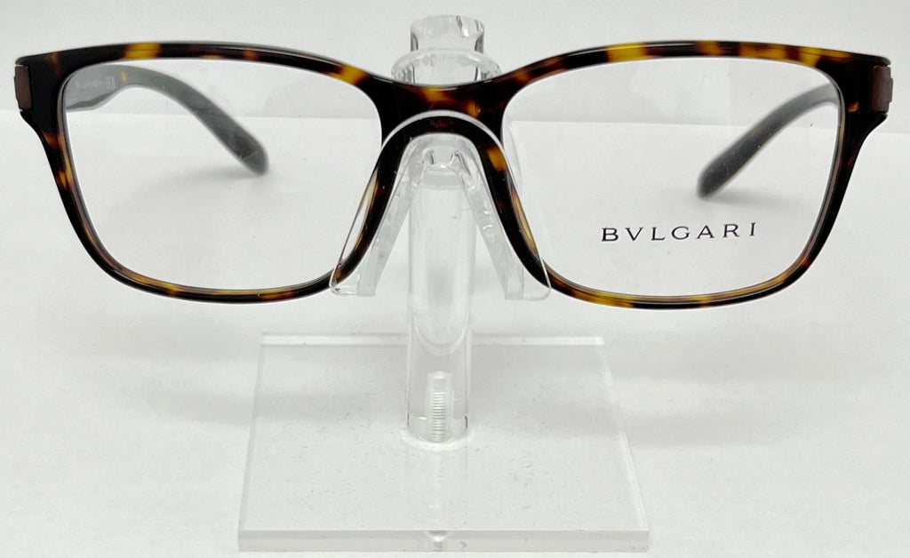 Bulgari eyeglasses on a clear stand against a white background