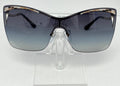 Sunglasses with a gradient lens on a clear stand against a white background