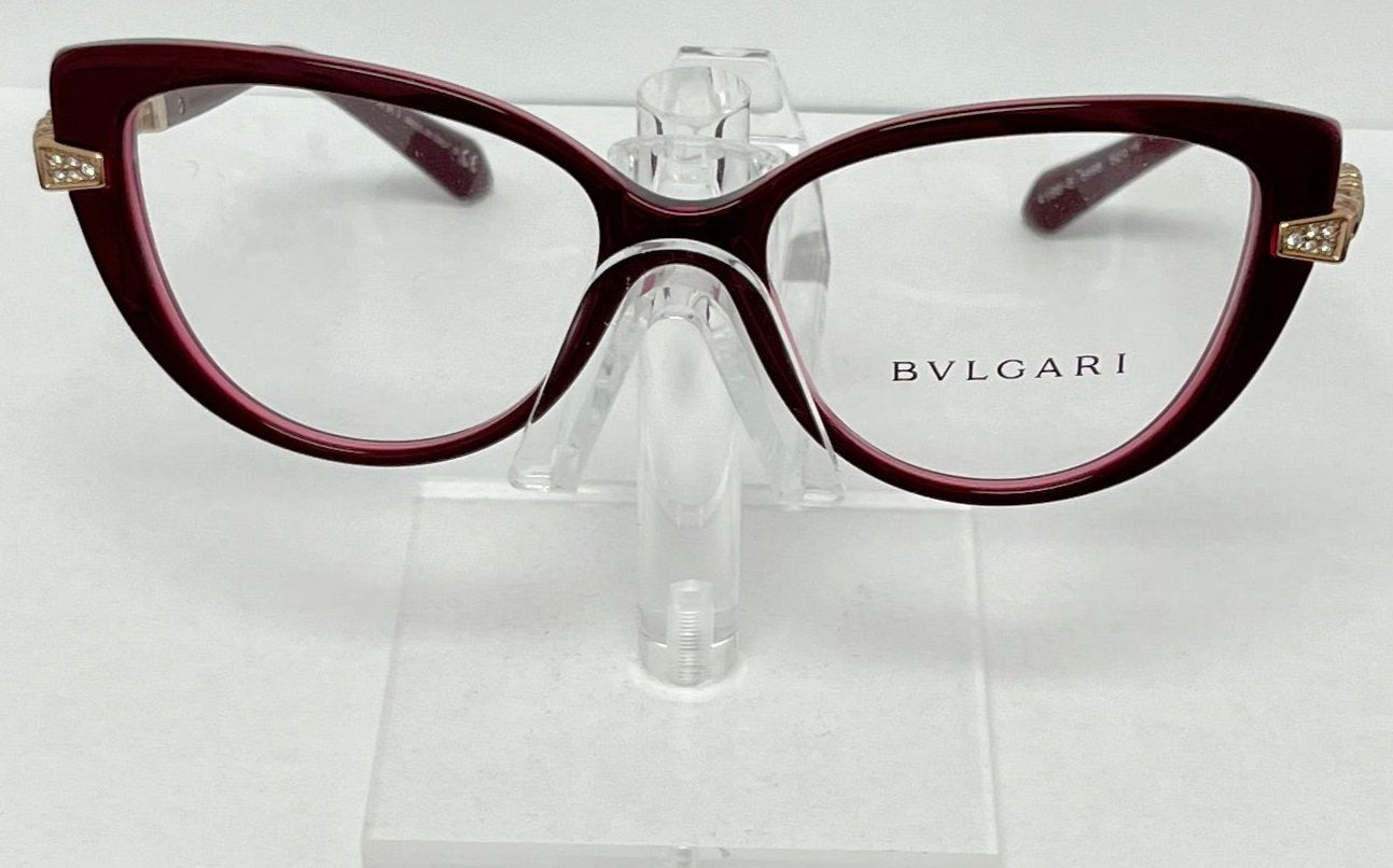 Bulgari eyeglasses on a clear stand against a white background