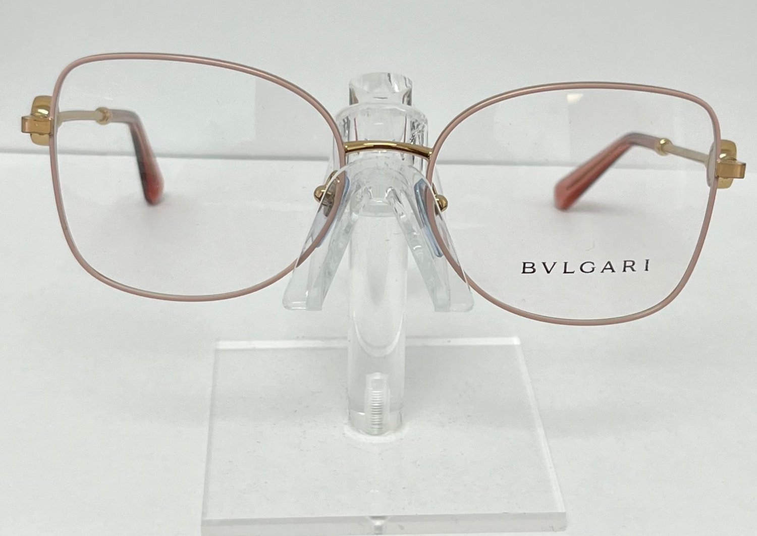 Bulgari eyeglasses on a clear stand against a white background