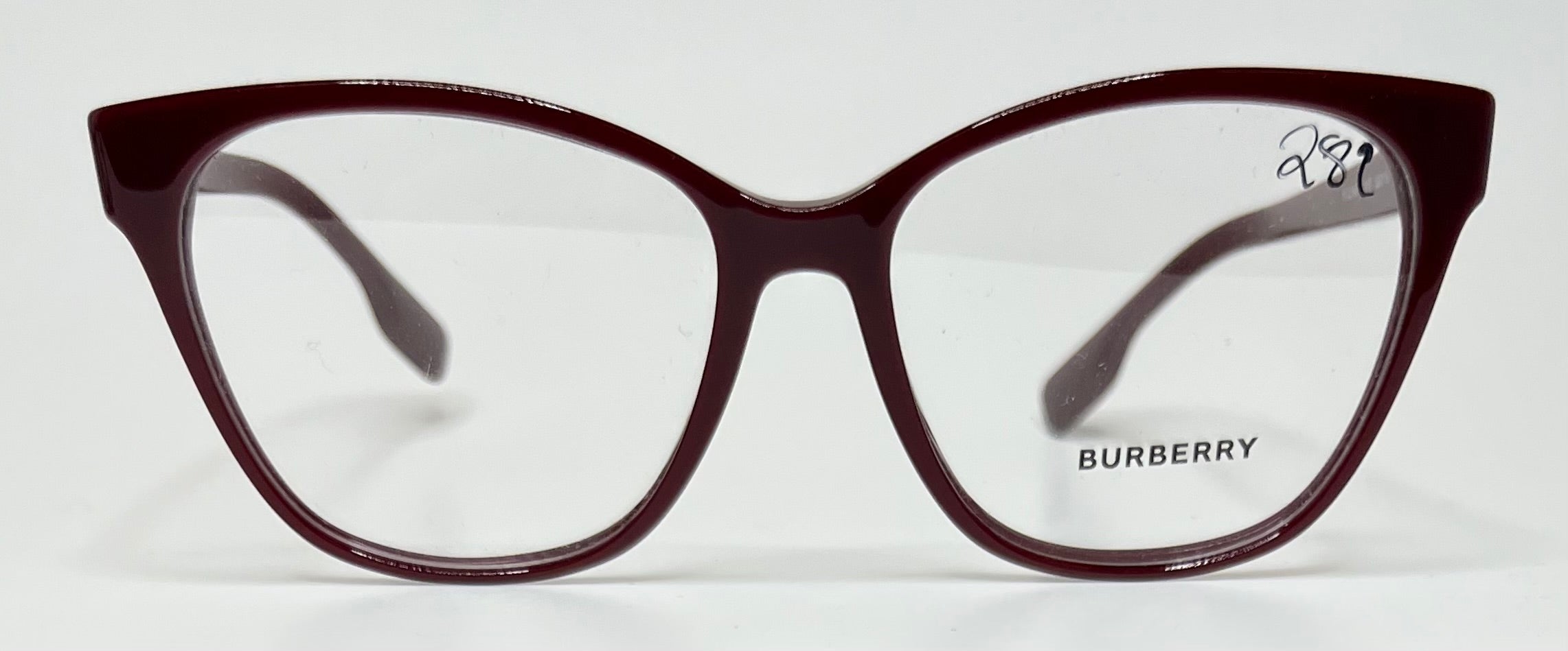 Burberry eyeglasses with a maroon frame on a white background