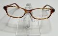 A pair of Ted Baker B705 ladies plastic eyeglass frames in a golden tortoise shade, displayed on a stand.