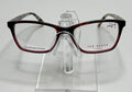 A pair of Ted Baker TPW006 ladies eyeglass frame in tortoise and blue color, displayed on a stand.