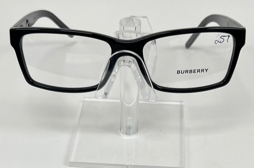 Black Burberry eyeglasses on a clear stand against a white background