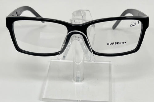 Black Burberry eyeglasses on a clear stand against a white background